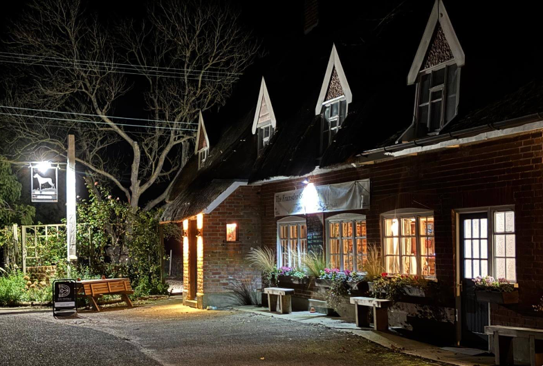 The outside of the Framsden Greyhound community-owned pub on a sunny day.
